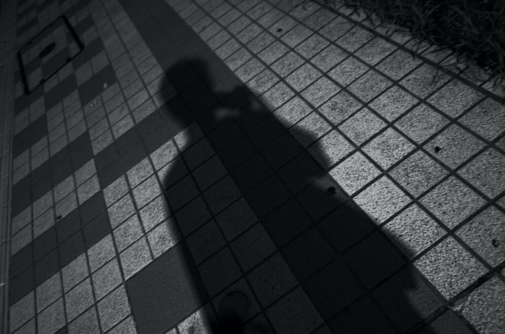shadow_of_person_on_gray_concrete_floor