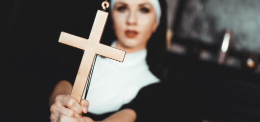 nun-holding-a-cross-the-concept-of-religion-scaled