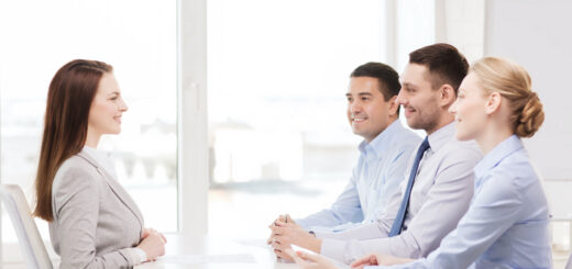 smiling-businesswoman-at-interview-in-office-scaled.j