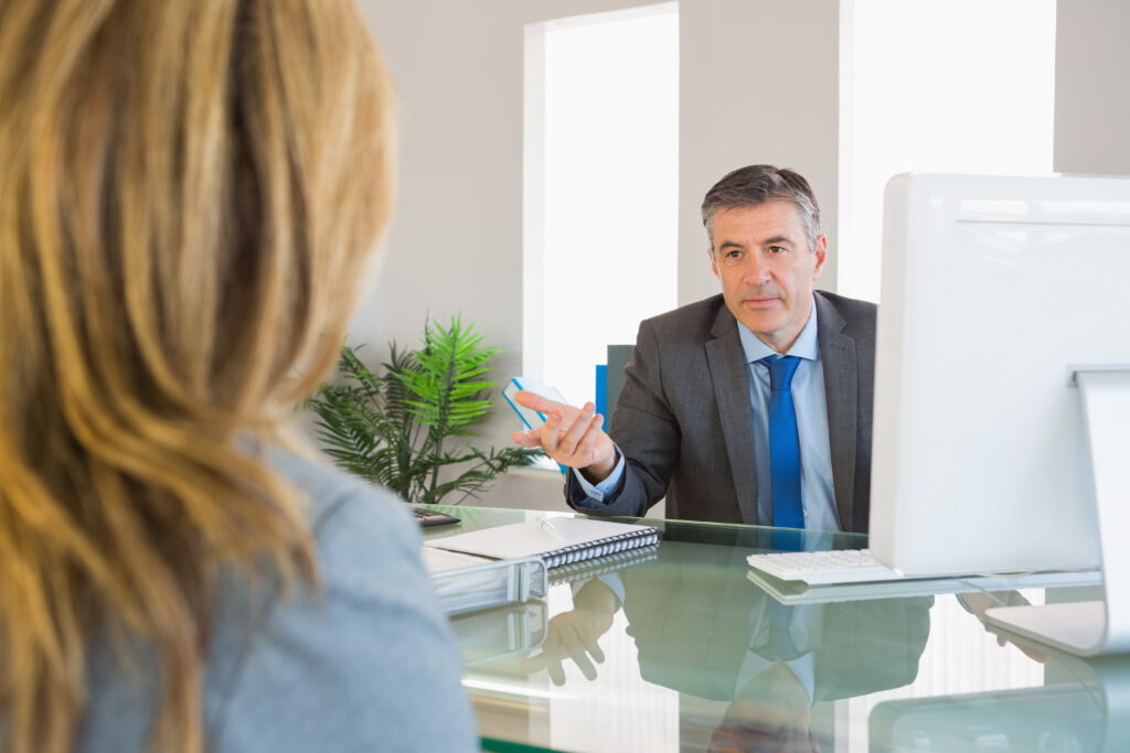 serious-businessman-having-a-discussion-with-a-colleague-scaled.