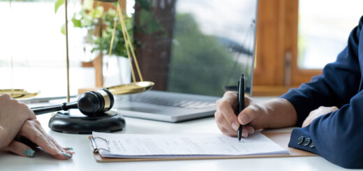 ustice-and-law-concept-legal-counsel-presents-to-the-client-a-signed-contract-with-gavel-and-legal-law-or-legal-having-team-meeting-at-law-firm-in-background-scaled