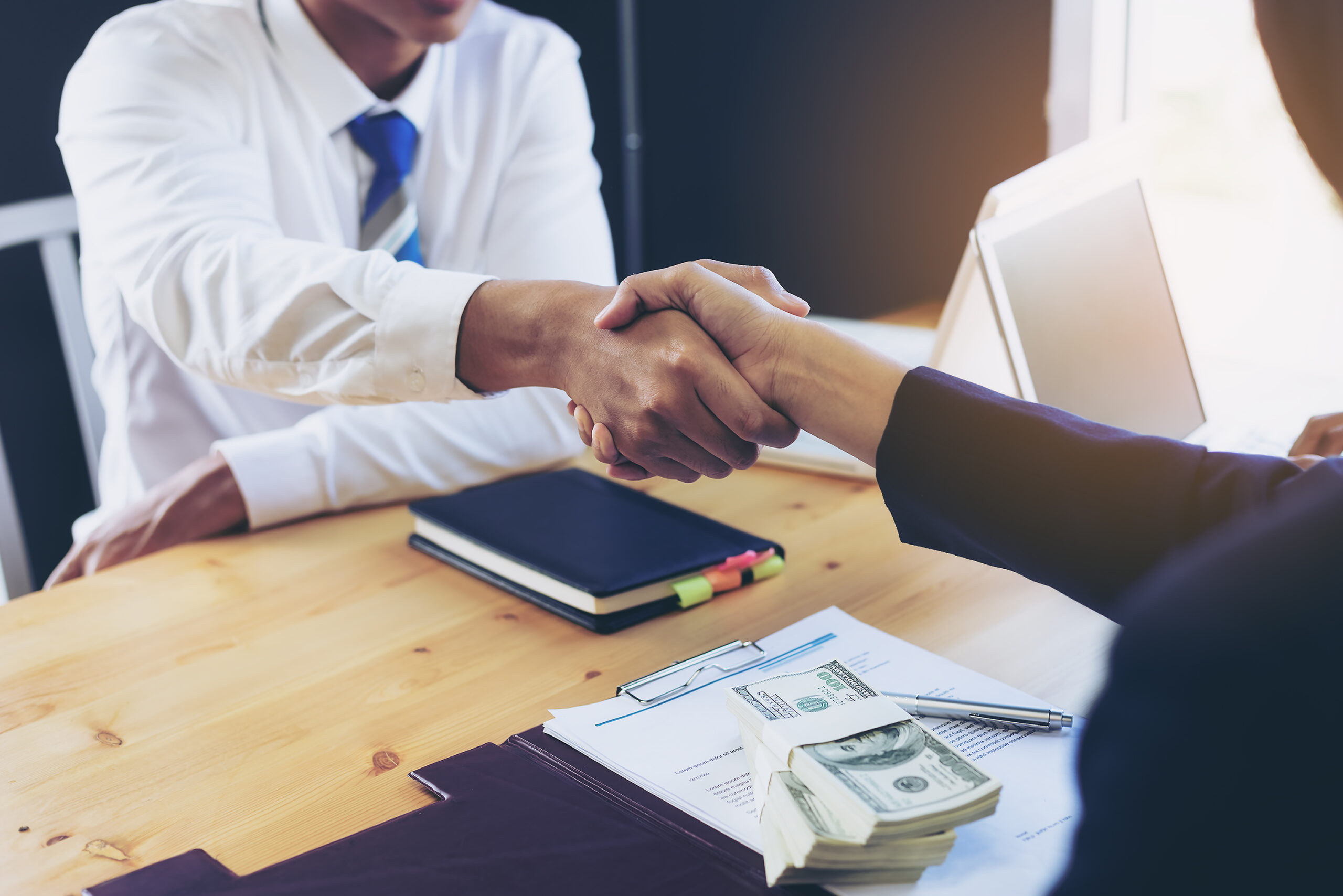 business-woman-signing-a-loan-for-investment-negotiation-scaled