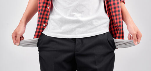 man-showing-his-empty-pockets-on-white-background-scaled