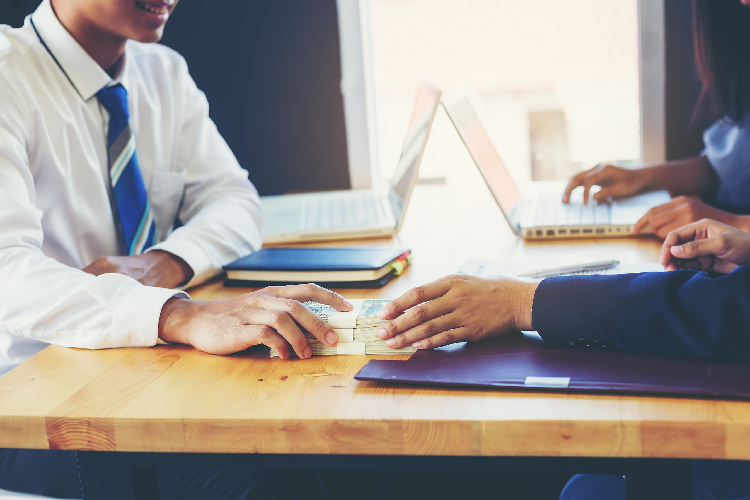 business-woman-signing-a-loan-for-investment-negotiation-scaled