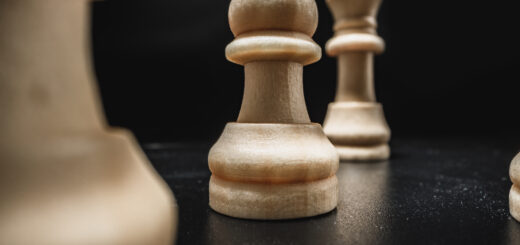 chess-game-with-chess-pieces-against-black-background-scaled