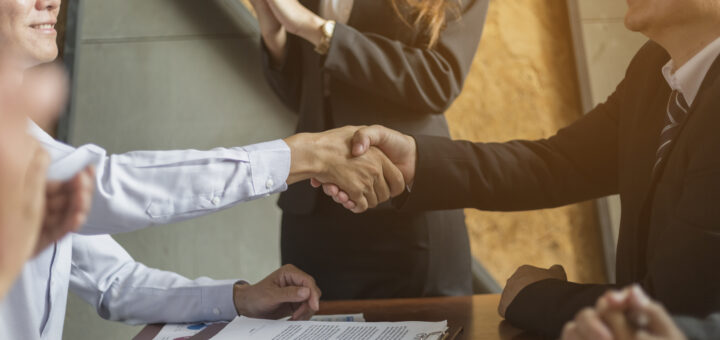 businessmen-shake-hands-after-business-negotiation-scaled.