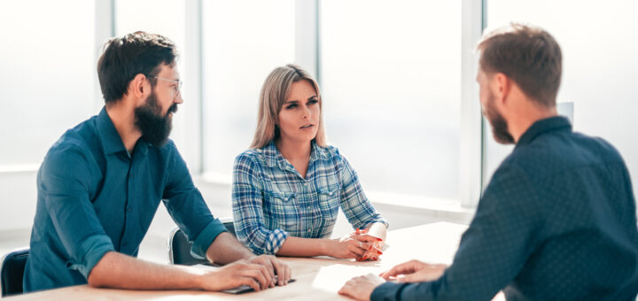 managers-and-job-seeker-sitting-at-the-table-during-the-interview-scaled