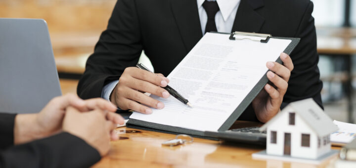 close-up-business-teamwork-signing-contract-partnership-agreement-making-deal-scaled