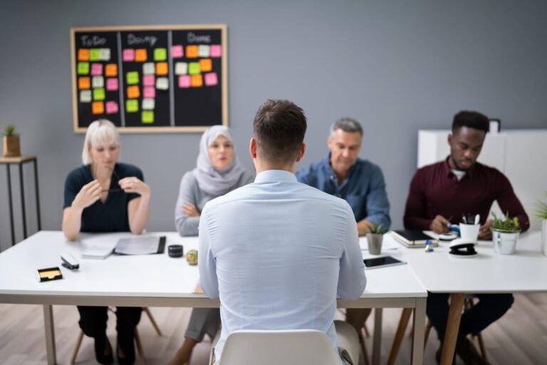 man-sitting-at-interview