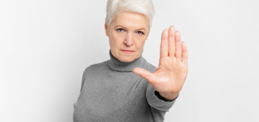 senior-lady-gesturing-stop-with-her-hand-scaled